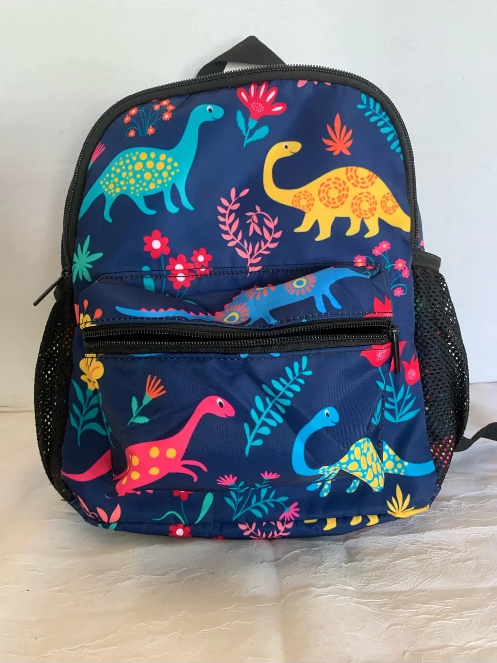 Child’s colorful dinosaur backpack